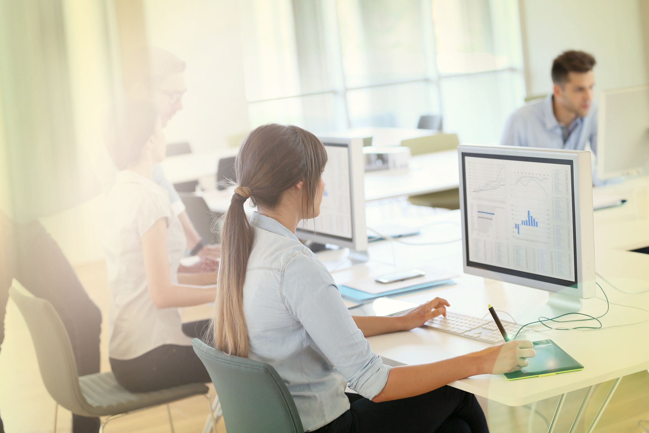 56558174 – creative people working in office on computer